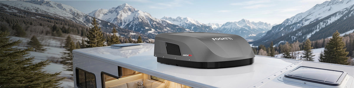 InstaCool Ultra RV rooftop air conditioner with heat pump, installed on a white RV against a beautiful snowy mountain backdrop.