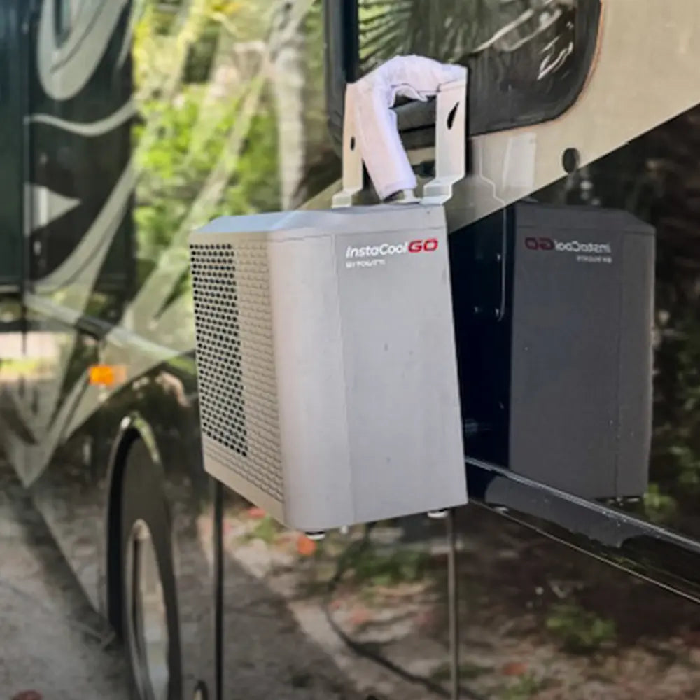 Side view of an RV featuring a mounted portable water heater for convenient shower experience.