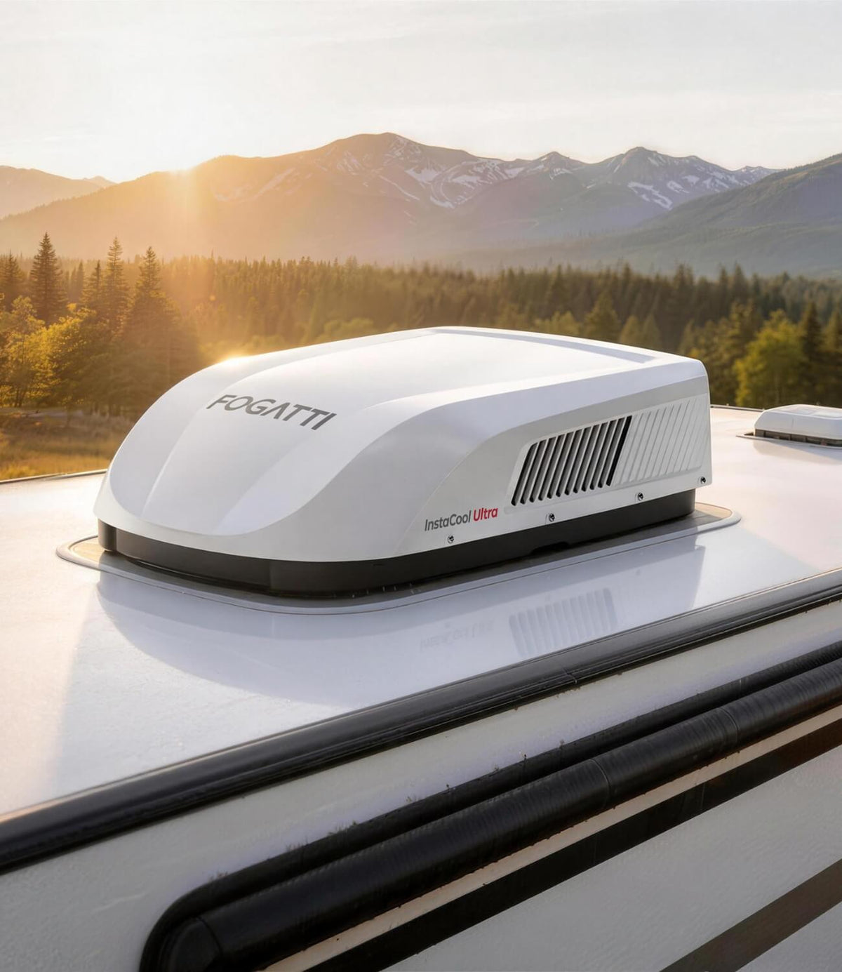 FOGATTI InstaCool Ultra RV Rooftop Air Conditioner installed on a camper roof, set against a beautiful mountain sunrise for outdoor adventures.